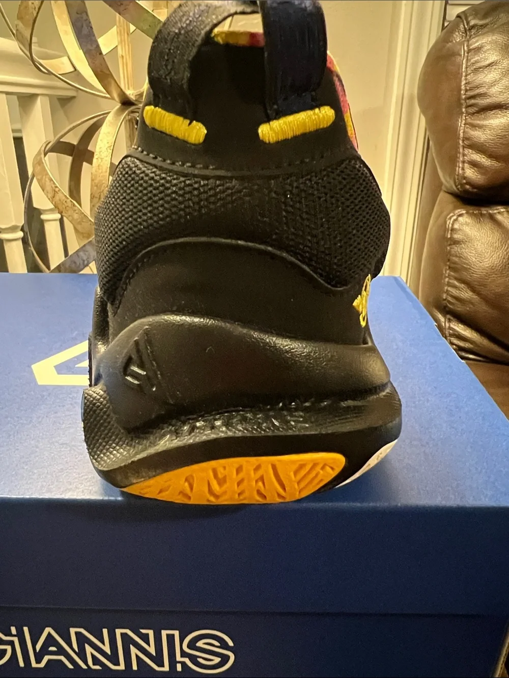 Nike Kids Black Sneakers with Yellow Accents and Multicolor Swoosh